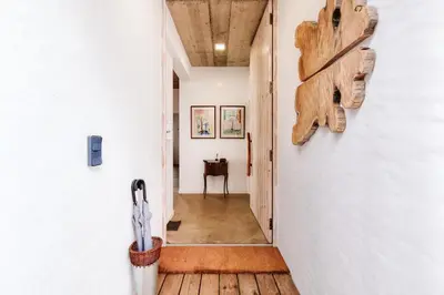 a hallway of a house with a wooden floor at CASA 61 by Stay Madeira Island in Ponta do Sol