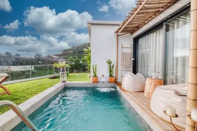 a swimming pool in the backyard of a house at CASA 61 by Stay Madeira Island in Ponta do Sol