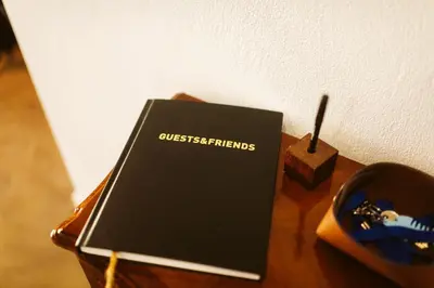 a book sitting on top of a wooden table at CASA 61 by Stay Madeira Island in Ponta do Sol