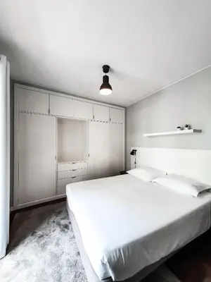 a white bedroom with a large white bed in it at Santa Luzia's Pearl II E - One Bedroom Apartment in Funchal