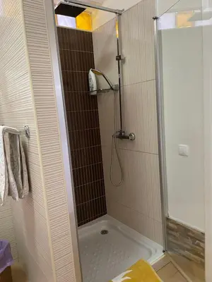 a shower with a glass door in a bathroom at Villa Isabela - Car Rental for Free in Caniço