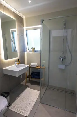 a bathroom with a shower and a sink at Casa Maravilha III in Caniço
