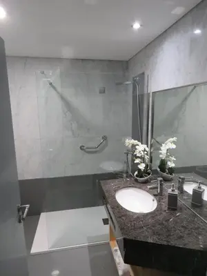 a bathroom with a sink and a shower at Sun Island Apartments in Funchal