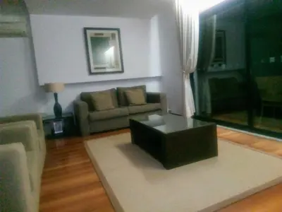 a living room with a couch and a coffee table at La Suite Calypso in Luz