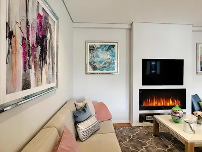 a living room with a couch and a fireplace at Paradise Apartment by LovelyStay in Funchal