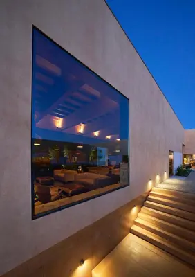 a large picture on the wall of a house with stairs at Praia do Canal Nature Retreat - Small Luxury Hotels of the World in Aljezur