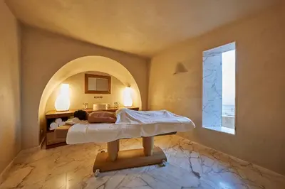a bedroom with a bed and a window at Praia do Canal Nature Retreat - Small Luxury Hotels of the World in Aljezur