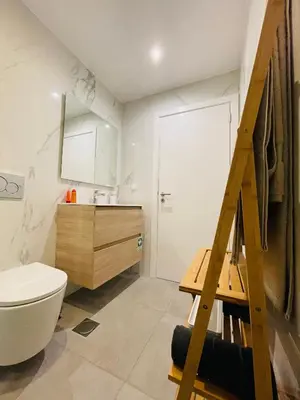 a bathroom with a ladder leading to a toilet and a sink at Living Funchal Apartments in Funchal
