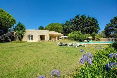 a house with a yard with a swimming pool at Villa Sounia by Villa Plus in Lagos