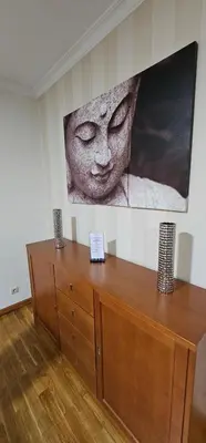 a wooden cabinet in a room with a picture on the wall at Suncoast Residence V (Free parking) in Funchal