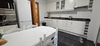 a kitchen with white cabinets and a white counter top at Suncoast Residence V (Free parking) in Funchal