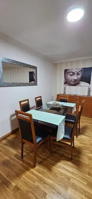a dining room with a table and chairs at Suncoast Residence V (Free parking) in Funchal