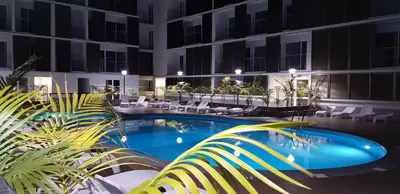 a swimming pool in front of a building at 1 Bed Apartment Sleeps 4 with Pool in Funchal