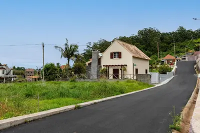 a house on the side of a road at Chalet do Monte no Porto Moniz by Homie in Lanceiros