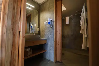 a bathroom with a sink and a mirror at QUINTA DO FALCÃO in Almagreira