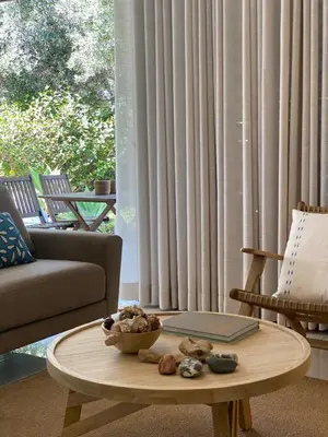 a living room with a coffee table and a couch at Bordal Houses Casa da Areia in Porto Santo