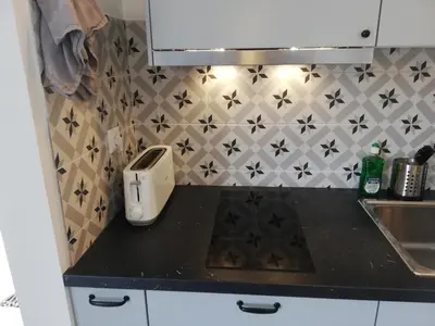 a kitchen with a counter top with a toaster on it at BELCH1952 in Lagos