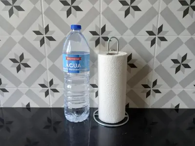 a bottle of water and a roll of toilet paper at BELCH1952 in Lagos