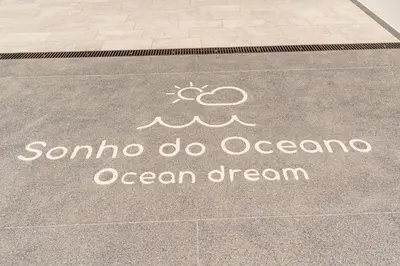 a sign on a sidewalk that saysaho do ocean ocean dream at Sonho do Oceano in Ribeira Brava