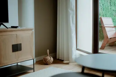 a living room with a large window and a table at Rooftop Marina l by Madeira Best Apartments in Funchal