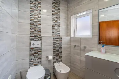 a bathroom with a toilet and a sink at Stunning sea view apartment in Burgau #1897 in Burgau