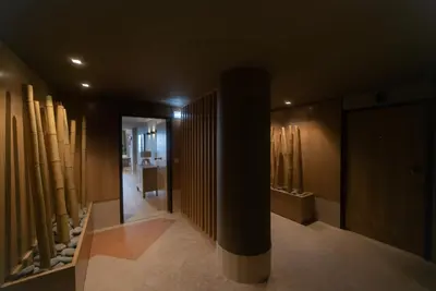 a hallway with wooden walls and a column in a building at Rooftop Marina ll by Madeira Best Apartments in Funchal