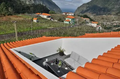 an orange and white amphitheater with orange seats at Sebastian's Apartment in São Vicente
