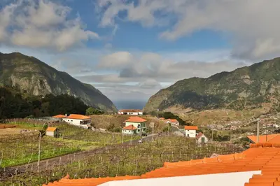 a view of a town in the mountains at Sebastian's Apartment in São Vicente
