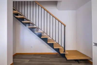 a staircase in a house with wooden treads at SolMar in Jardim do Mar