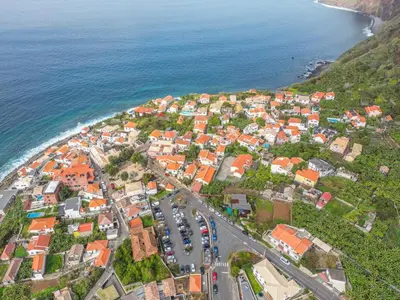 an aerial view of a town next to the ocean at SolMar in Jardim do Mar