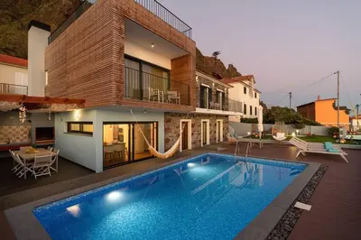 an overhead view of a swimming pool and chairs at Villa Sea - Rural Holiday Experience by SeaPearl in Paul do Mar