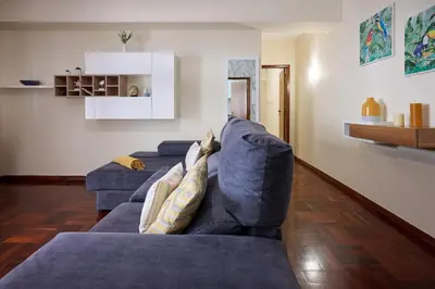 a living room with two blue couches at Mon Coin Dans La Ville by Homie in Funchal