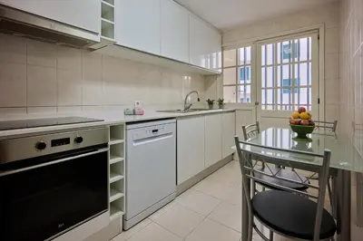 a kitchen with a table and a sink at Mon Coin Dans La Ville by Homie in Funchal