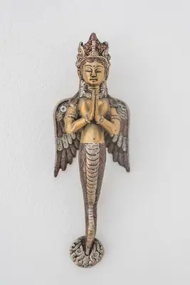 a statue of an angel with a crown on its head at Casa dos Sonhos in Luz