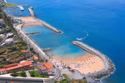 an aerial view of a beach with a pier at Cottage Pearl - Rural Holiday Experience by SeaPearl in Paul do Mar
