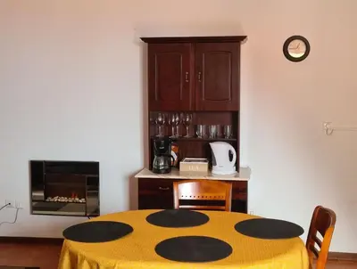 a kitchen with a table with a yellow table cloth at Scenic Comfort in Ponta Delgada