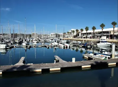 a marina with alot of boats in the water at Beautiful Villa on Boavista Golf Resort - Daily Service & Spa Access in Lagos