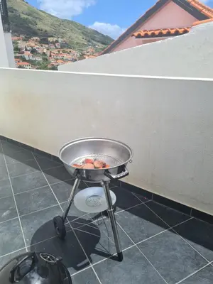 a grill on the floor of a balcony at Machico Comfort in Machico