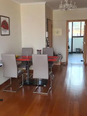 a room with a table and chairs and a dining room at Machico Comfort in Machico