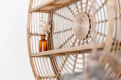 a bird cage with a vase on a shelf at LemonTree Eco Surfhouse in Sagres