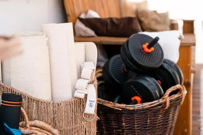 a basket filled with dishes and paper towels at LemonTree Eco Surfhouse in Sagres