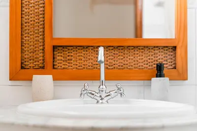 a sink with a faucet in a bathroom at LemonTree Eco Surfhouse in Sagres