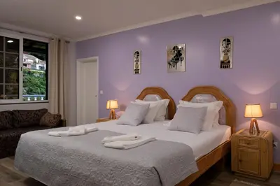 a bedroom with a large bed with two towels on it at Vila do Largo by Homie in São Vicente