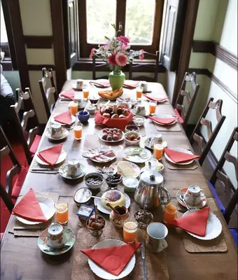 a wooden table with plates of food on it at Casa Grande Portugal in Burgau