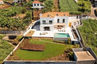 an aerial view of a house with a garden at Villa Horizonte Azul by Holiday Rental Madeira in Ponta do Sol