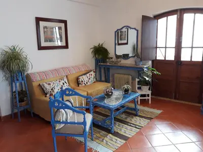 a living room with a couch and a table at Agua de Sonho 2 in Bensafrim