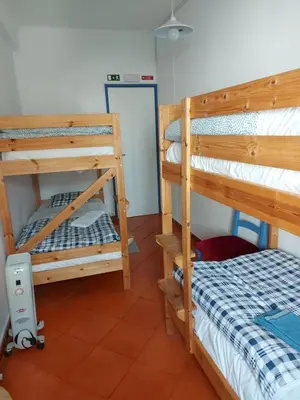 a bedroom with two bunk beds in a room at Agua de Sonho 2 in Bensafrim