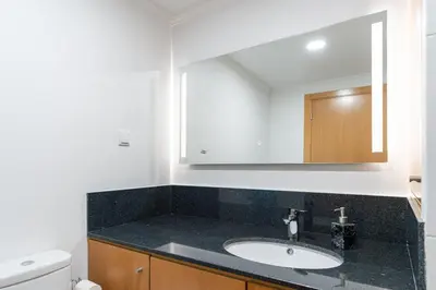 a bathroom with a sink and a mirror at Casa Terra-Boa in Arco da Calheta
