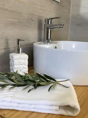 a bathroom with a sink and a towel at AltaVista Lodge in Luz