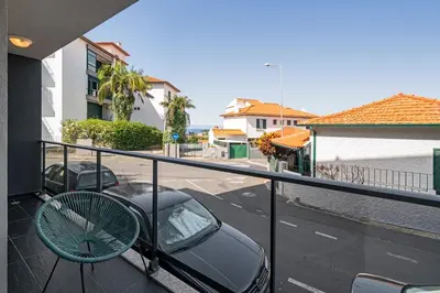 a car parked on a balcony with a tennis racket at Pena II by An Island Apart in Funchal
